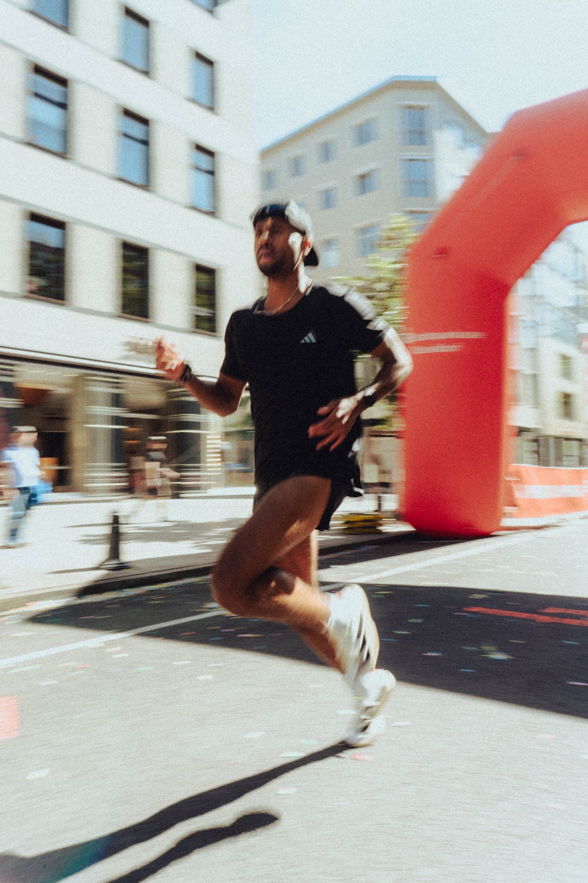Runner passing the finish arch at a road race